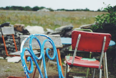 Chairs and table on field