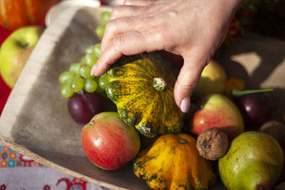 Autumn fruits. harvest in village. vegetables and fruits. hand takes fruit. details of healthy food.