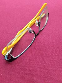 Close up of eyeglasses on red tablecloth