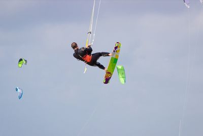 Low angle view of girl jumping