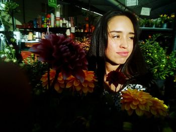 Beautiful young woman with flower bouquet