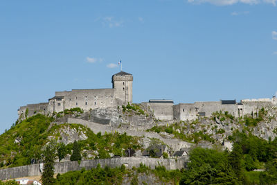 Low angle view of fort against blue sky