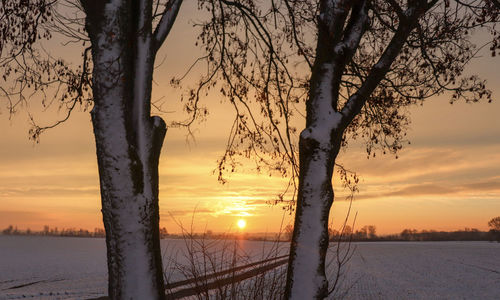 Scenic view of snow during sunset