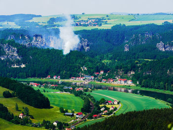 High angle view of trees and landscape against sky