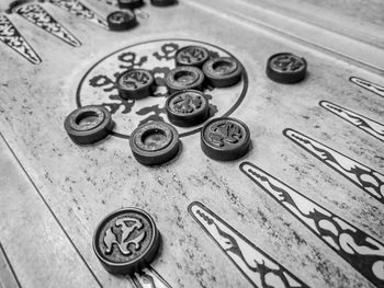 High angle view of coins on paper