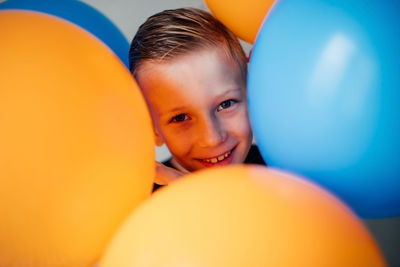 Portrait of cute boy with balloons