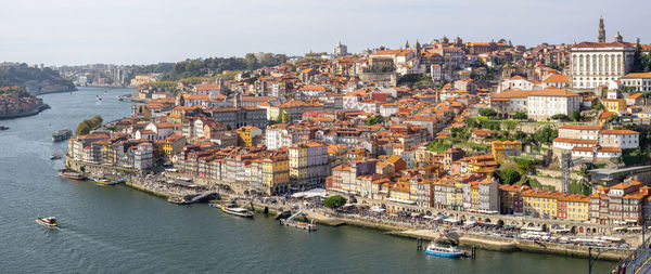 High angle view of river amidst buildings in town