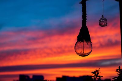 Low angle view of silhouette decoration against sky at sunset