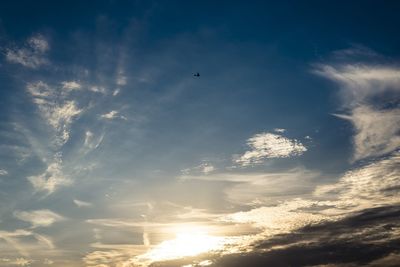 Low angle view of airplane flying in sky