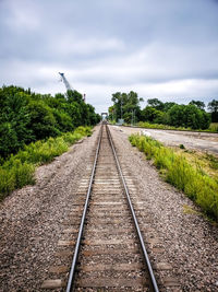 Surface level of railroad tracks against sky