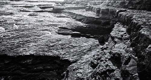 Close-up of rock formation in water