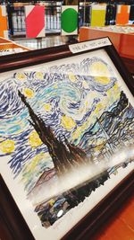 High angle view of graffiti on table