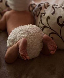Cute newborn baby lie on tummy in reusable diaper