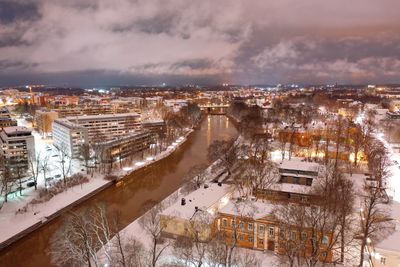 High angle view of illuminated buildings in city during winter