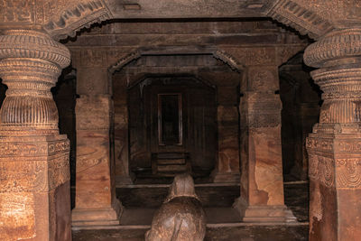 Badami cave sculptures of hindu gods carved on roof ancient stone art in details