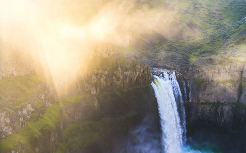 Scenic view of waterfall in forest