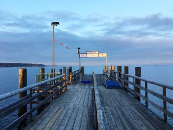 Pier over sea against sky