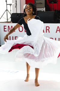 Full length of a smiling young woman