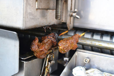 High angle view of meat on barbecue grill