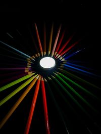 Low angle view of illuminated lights at night