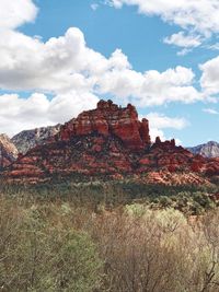 Rock formations on landscape against sky