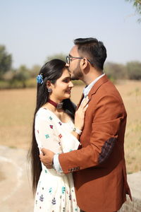 Young couple standing on land