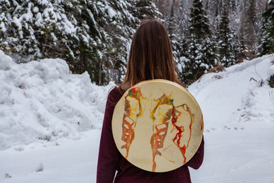 Rear view of woman holding ice cream cone