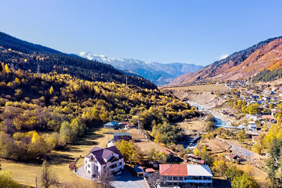 High angle view of houses and trees against sky