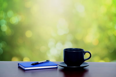 Close-up of coffee cup on table