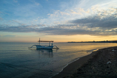 Fisherman traditional boats at lovina beach, bali, indonesia.