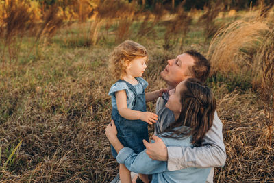 Young couple with cute two-years-old girl