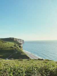 Scenic view of sea against sky cliffs etretat green grass beach view holiday travel sunny day sun 