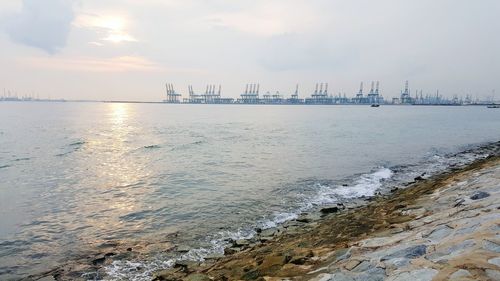 Scenic view of sea against cloudy sky