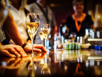 People having wine on bar counter