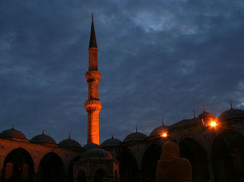 Low angle view of illuminated cathedral against sky at night