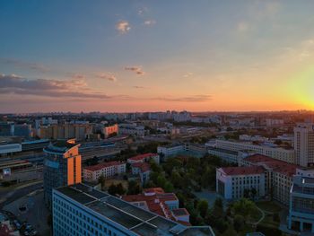 High angle view of buildings against sky during sunset