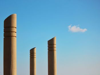 Low angle view of built structure against clear blue sky