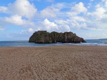 Scenic view of beach against sky