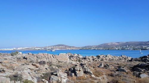 Scenic view of sea against clear blue sky