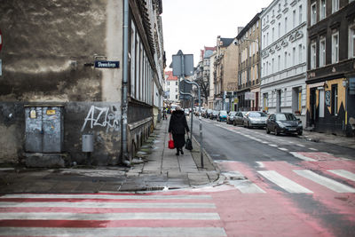 Man walking on street in city