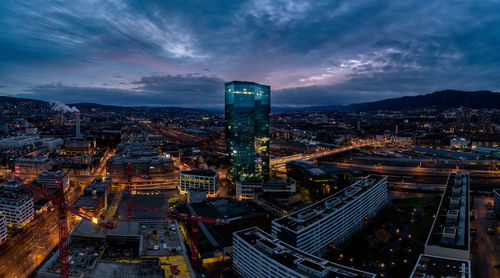 High angle view of illuminated city buildings at night