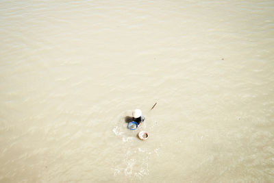 High angle view of man fishing in river