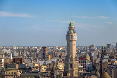 Buildings in city against sky