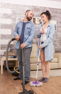 Young couple standing on floor