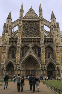 People at temple against sky