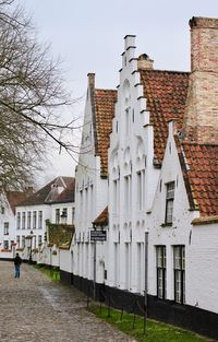 Exterior of houses in town against clear sky