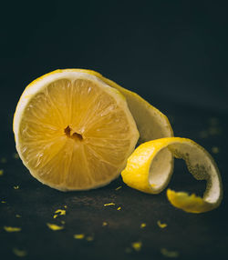 Close-up of lemon slice against black background