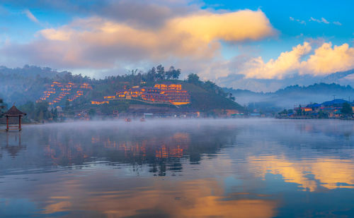 Scenic view of lake against sky during sunset