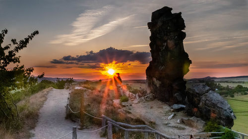 Scenic view of field against sky during sunset