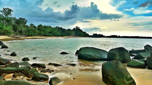 Scenic view of sea against cloudy sky